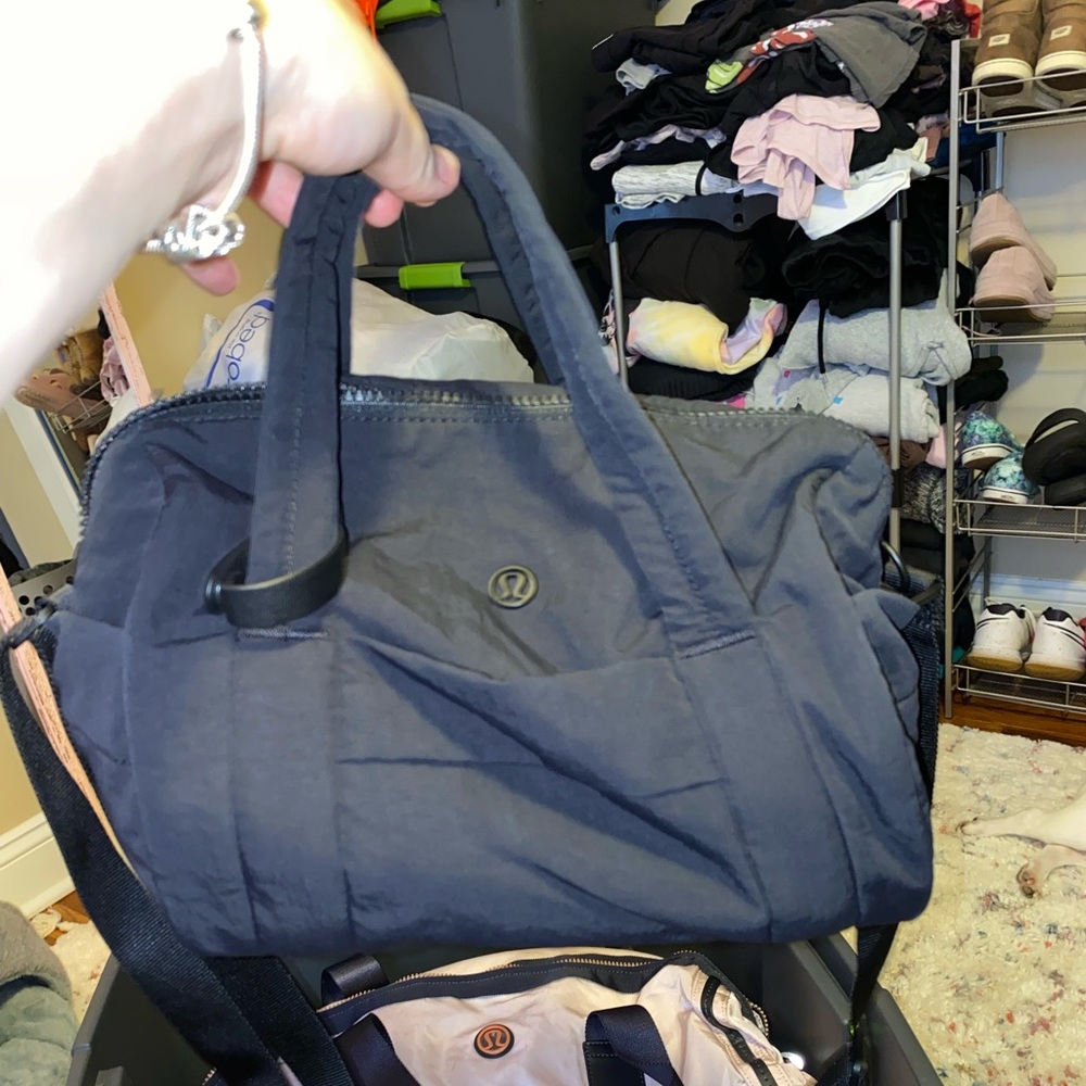 Lululemon small black shoulder bag (forget name)